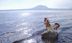 Size: 1024x605 | Tagged: safe, derpibooru import, photographer:pakapaka1993, autumn blaze, kirin, pony, irl, japan, mountain, ocean, photo, plushie, rock, solo, water