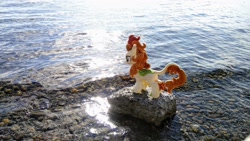 Size: 2048x1152 | Tagged: safe, derpibooru import, photographer:pakapaka1993, autumn blaze, kirin, pony, irl, japan, photo, plushie, rock, solo