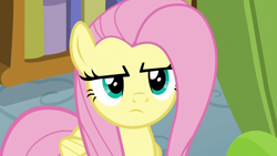 Size: 1280x720 | Tagged: safe, derpibooru import, screencap, fluttershy, pegasus, pony, flutter brutter, disappointed, female, fluttershy is not amused, frown, mare, narrowed eyes, solo, unamused