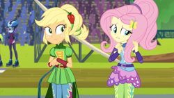 Size: 3410x1920 | Tagged: safe, derpibooru import, screencap, applejack, fluttershy, lemon zest, sunny flare, equestria girls, friendship games, duo, duo female, duo focus, female, goggles, helmet, high res, offscreen character, roller skates