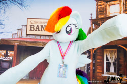 Size: 2000x1330 | Tagged: safe, artist:kuou, derpibooru import, rainbow dash, human, pegasus, pony, arms wide open, clothes, convention, cosplay, costume, fursuit, irl, irl human, japan, lanyard, no mouth, photo, ponysuit, solo, tail, wild west, wings