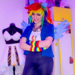 Size: 1080x1080 | Tagged: safe, derpibooru import, rainbow dash, human, clothes, cosplay, costume, crossed arms, cutie mark on clothes, goggles, irl, irl human, multicolored hair, photo, rainbow hair, solo
