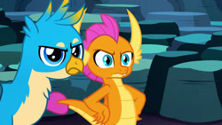 Size: 1920x1080 | Tagged: safe, derpibooru import, screencap, gallus, smolder, dragon, griffon, uprooted, dragoness, female, gallus is not amused, hand on hip, male, smolder is not amused, unamused