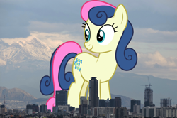 Size: 1280x848 | Tagged: safe, artist:cloudyglow, artist:thegiantponyfan, derpibooru import, bon bon, sweetie drops, earth pony, pony, background pony, female, giant bon bon (sweetie drops), giant pony, giant/macro earth pony, giantess, highrise ponies, irl, looking back, macro, mare, mega bon bon, mega giant, mexico, mexico city, photo, ponies in real life, smiling, standing