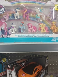 Size: 3000x4000 | Tagged: safe, derpibooru import, applejack, fluttershy, pinkie pie, princess cadance, princess celestia, princess flurry heart, rainbow dash, rarity, shining armor, twilight sparkle, earth pony, pegasus, unicorn, friendship is magic, box, mane six, merchandise, packaging, photo, rainbow, shelf, store, toy