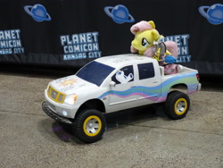 Size: 3648x2736 | Tagged: safe, derpibooru import, discord, fluttershy, shining armor, draconequus, pegasus, pony, unicorn, 4de, autograph, convention, female, funko, irl, male, nissan, photo, pickup truck, planet comicon, plushie, toy