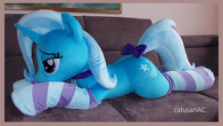 Size: 3952x2248 | Tagged: safe, artist:calusariac, derpibooru import, trixie, pony, bow, clothes, irl, life size, lying down, photo, plushie, prone, socks, solo, striped socks, tail, tail bow