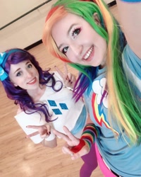 Size: 1080x1350 | Tagged: safe, derpibooru import, rainbow dash, rarity, human, clothes, cosplay, costume, cutie mark on clothes, duo, irl, irl human, multicolored hair, peace sign, photo, rainbow hair