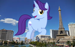 Size: 3072x1932 | Tagged: safe, artist:cheezedoodle96, artist:thegiantponyfan, derpibooru import, edit, november rain, pony, unicorn, friendship student, giant pony, giant unicorn, high res, highrise ponies, irl, las vegas, looking at you, macro, male, mega giant, nevada, open mouth, photo, ponies in real life, raised hoof, raised leg, smiling, smiling at you, solo, stallion