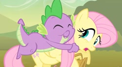 Size: 1280x705 | Tagged: safe, derpibooru import, screencap, fluttershy, spike, dragon, pegasus, pony, feeling pinkie keen, basket, eyes closed, female, froggy bottom bog, holding, hug, male, mare, not what it looks like, out of context, shocked, smiling, wings, youtube link