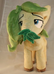 Size: 1580x2144 | Tagged: safe, artist:bastler, derpibooru import, oc, oc only, oc:nettle vienna, earth pony, pony, female, irl, leaves, mare, photo, plushie