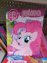 Size: 3000x4000 | Tagged: safe, derpibooru import, pinkie pie, earth pony, pony, coloring book, dollar tree, error, female, high res, irl, mare, my little pony jumbo coloring book, my little pony logo, open mouth, open smile, photo, raised hoof, raised leg, smiling, solo