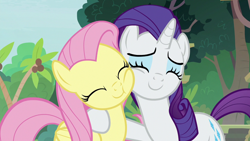 Size: 1280x720 | Tagged: safe, derpibooru import, screencap, fluttershy, rarity, pegasus, pony, unicorn, fake it 'til you make it, season 8, spoiler:s08, ^^, cheek nuzzle, cheek squish, cheek to cheek, cute, daaaaaaaaaaaw, duo, duo female, eyes closed, female, happy, hug, mare, nuzzling, raribetes, shyabetes, squishy cheeks