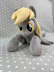 Size: 3024x4032 | Tagged: safe, artist:kazzysart, derpibooru import, derpy hooves, pony, irl, lying down, photo, plushie, prone, solo