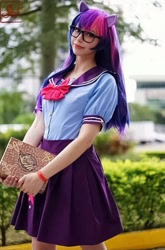 Size: 711x1080 | Tagged: safe, artist:flutterbutter cosplay, derpibooru import, twilight sparkle, human, book, book of harmony, clothes, cosplay, costume, glasses, irl, irl human, photo