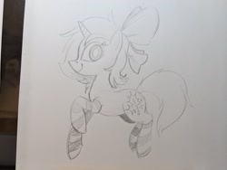 Size: 2048x1536 | Tagged: safe, artist:mellodillo, derpibooru import, oc, oc only, pony, unicorn, bow, clothes, female, grayscale, hair bow, looking at you, mare, monochrome, pencil drawing, smiling, socks, solo, striped socks, traditional art