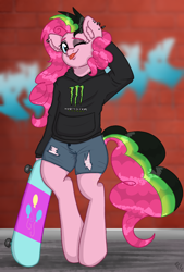 Size: 1846x2723 | Tagged: safe, artist:ponykittenboi, derpibooru exclusive, derpibooru import, pinkie pie, earth pony, semi-anthro, ;p, alternate hairstyle, arm behind head, bipedal, brick wall, clothes, cutie mark, denim, denim shorts, dyed mane, dyed tail, ear fluff, ear piercing, ears, eyeshadow, graffiti, hoodie, logo, makeup, monster energy, one eye closed, piercing, punkie pie, shitposting, shorts, skateboard, solo, tail, tongue, tongue out, torn clothes, wink