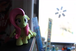 Size: 5184x3456 | Tagged: safe, artist:dustysculptures, derpibooru import, fluttershy, pegasus, pony, craft, female, frown, looking up, mare, sculpture, sitting, solo