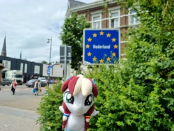 Size: 4032x3024 | Tagged: safe, artist:xeto_de, oc, oc:vanilla cream, car, female, filly, foal, irl, netherlands, plushie, sign