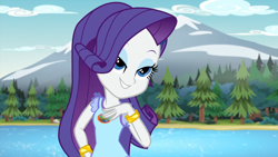 Size: 1920x1080 | Tagged: safe, derpibooru import, screencap, rarity, human, equestria girls, legend of everfree, eyebrows, eyeshadow, female, grin, hand on hip, lidded eyes, makeup, mountain, river, smiling, solo, tree, water