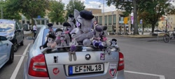 Size: 4640x2088 | Tagged: safe, derpibooru import, octavia melody, earth pony, human, pony, car, galacon 2022, irl, irl human, license plate, multeity, namesake, octaviocalypse, photo, plushie, pun, skoda, skoda octavia, sticker, tree, visual pun