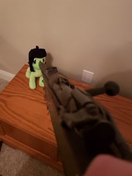 Size: 2451x3275 | Tagged: safe, ponerpics import, oc, oc:anon filly, cabinet, clothes, female, filly, foal, gloves, gun, hand, irl, outlet, photo, plushie, rifle, weapon