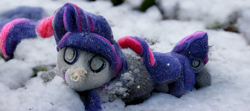 Size: 2304x1024 | Tagged: safe, derpibooru import, generator:midjourney, machine learning generated, artificial intelligence, damaged, deformed, depth of field, female, missing horn, plushie, realistic, snow, solo