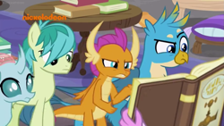 Size: 1249x702 | Tagged: safe, derpibooru import, screencap, gallus, ocellus, sandbar, silverstream, smolder, changedling, changeling, classical hippogriff, dragon, earth pony, griffon, hippogriff, pony, what lies beneath, book, offscreen character, pillow, raised eyebrow, table