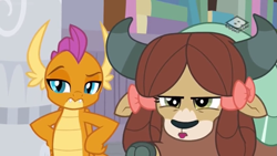 Size: 1249x703 | Tagged: safe, derpibooru import, screencap, smolder, yona, dragon, yak, the hearth's warming club, bow, cloven hooves, dragoness, duo, female, hair bow, hand on hip, monkey swings, raised eyebrow, smolder is not amused, unamused, yona is not amused