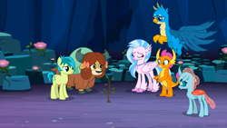 Size: 1600x900 | Tagged: safe, derpibooru import, screencap, gallus, ocellus, sandbar, silverstream, smolder, yona, changedling, changeling, classical hippogriff, dragon, earth pony, griffon, hippogriff, pony, yak, uprooted, bow, cloven hooves, colored hooves, eyes closed, hair bow, jewelry, monkey swings, necklace, student six