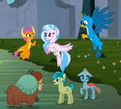 Size: 655x591 | Tagged: safe, derpibooru import, screencap, gallus, ocellus, sandbar, silverstream, smolder, yona, changedling, changeling, classical hippogriff, dragon, earth pony, griffon, hippogriff, pony, yak, uprooted, bow, cloven hooves, colored hooves, cropped, cute, diaocelles, diastreamies, dragoness, eyes closed, female, flying, gallabetes, hair bow, jewelry, looking at you, male, monkey swings, necklace, sandabetes, smiling, smolderbetes, student six, teenager, yonadorable