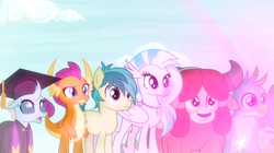 Size: 1600x898 | Tagged: safe, derpibooru import, screencap, gallus, ocellus, sandbar, silverstream, smolder, yona, changedling, changeling, classical hippogriff, dragon, earth pony, griffon, hippogriff, pony, yak, uprooted, bow, clothes, dragoness, female, glowing, graduation cap, hair bow, hat, jewelry, male, monkey swings, necklace, raised eyebrow, robe, student six