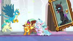 Size: 1280x719 | Tagged: safe, derpibooru import, screencap, gallus, ocellus, sandbar, silverstream, smolder, yona, changedling, changeling, classical hippogriff, dragon, earth pony, griffon, hippogriff, pony, yak, a matter of principals, cloven hooves, colored hooves, eyes closed, flying, mirage (character), picture frame, scared, spread wings, student six, wings