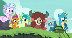 Size: 1291x683 | Tagged: safe, derpibooru import, screencap, gallus, ocellus, sandbar, silverstream, smolder, yona, changedling, changeling, classical hippogriff, dragon, earth pony, griffon, hippogriff, pony, yak, non-compete clause, cropped, looking down, student six