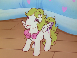 Size: 960x720 | Tagged: safe, derpibooru import, screencap, baby surprise, pegasus, pony, escape from catrina, g1, my little pony 'n friends, baby, baby pony, bow, female, filly, foal, jewelry, necklace, solo, spread wings, tail, tail bow, wings