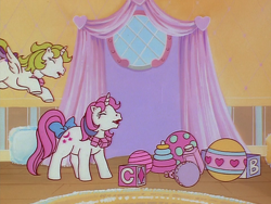 Size: 960x720 | Tagged: safe, derpibooru import, screencap, baby moondancer, baby surprise, alicorn, pony, unicorn, escape from catrina, g1, my little pony 'n friends, animation error, baby, baby pony, ball, blocks, bow, duo, female, filly, foal, jewelry, necklace, nursery, spot the alicorn, spread wings, tail, tail bow, wings