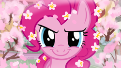 Size: 1280x720 | Tagged: safe, derpibooru import, edit, edited screencap, editor:horsesplease, screencap, pinkie pie, earth pony, plant pony, pony, a friend in deed, season 2, adorabolical, bloom, cherry blossoms, close-up, cute, dryad, evil grin, flower, flower blossom, flower in hair, grin, looking at you, pink, sakura pie, smiling, smiling at you, smirk, solo, trapped, tree, tree pony