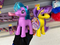 Size: 1280x960 | Tagged: safe, derpibooru import, human, unicorn, bootleg, colored horn, duo, female, hand, hoof shoes, horn, incorrect hair placement, irl, irl human, mare, photo, shelf, toy, zuru sparkle girlz