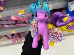 Size: 1280x960 | Tagged: safe, derpibooru import, human, pony, unicorn, bootleg, colored horn, female, front view, horn, incorrect hair placement, irl, irl human, looking at you, mare, photo, shelf, toy, zuru sparkle girlz