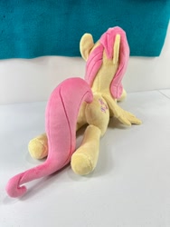 Size: 780x1040 | Tagged: safe, artist:kazzysplush, derpibooru import, fluttershy, pegasus, pony, butt, eyelashes, female, flutterbutt, for sale, irl, lying down, mare, photo, plot, plushie, prone, rear view, sitting, solo, sploot