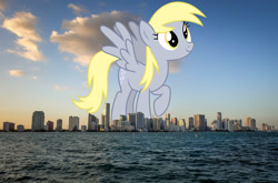 Size: 1600x1056 | Tagged: safe, artist:sketchmcreations, derpibooru import, edit, editor:jaredking779, derpy hooves, pegasus, pony, background pony, female, florida, giant pony, giantess, highrise ponies, irl, macro, mare, miami, photo, ponies in real life, solo, spread wings, story included, wings