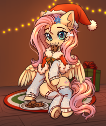 Size: 3800x4500 | Tagged: safe, artist:konejo, derpibooru import, fluttershy, pegasus, pony, g4, absurd resolution, christmas, christmas lights, clothes, commission, cookie, cute, daaaaaaaaaaaw, ear fluff, ears, eyebrows, female, food, hair accessory, hat, high res, holiday, indoors, leg warmers, looking at you, mare, mouth hold, partially open wings, pelerine, present, raised hoof, raised leg, santa hat, shyabetes, sitting, smiling, smiling at you, solo, underhoof, wings