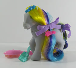 Size: 674x600 | Tagged: safe, derpibooru import, earth pony, pony, g1, barrette, bow, brush, brush 'n grow ponies, comb, female, hair bow, irl, mane, mare, photo, raised hoof, raised leg, ringlets (g1), smiling, tail, tail bow, toy