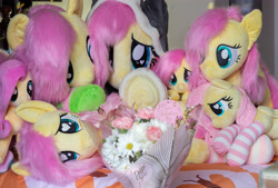 Size: 5119x3456 | Tagged: safe, artist:natureshy, derpibooru import, fluttershy, original species, pegasus, pony, bed, bouquet, clothes, cute, flower, heart, heart eyes, hearts and hooves day, holiday, multeity, photo, plush pony, plushie, present, shyabetes, so much flutter, socks, striped socks, valentine's day, wingding eyes