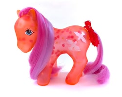 Size: 570x453 | Tagged: safe, derpibooru import, brightglow, earth pony, pony, g1, bow, brushable, female, glow 'n show ponies, irl, mare, merchandise, photo, simple background, solo, tail, tail bow, toy, translucent, white background