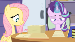 Size: 1280x721 | Tagged: safe, artist:agrol, derpibooru import, fluttershy, starlight glimmer, book, paperwork, pencil, quill, school of friendship, the element of kindness