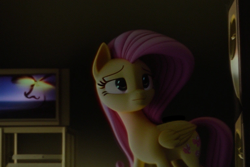 Size: 768x512 | Tagged: safe, derpibooru import, machine learning generated, fluttershy, pegasus, pony, 3d, 3d model, blurry background, cutie mark, eyes open, fake, pink hair, pink mane, realistic, room, sad, sad face, solo, television, vhs, watching