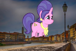 Size: 2047x1356 | Tagged: safe, artist:thebosscamacho, derpibooru import, edit, editor:jaredking779, cookie crumbles, pony, unicorn, clothes, ear piercing, female, giant pony, giant unicorn, giantess, highrise ponies, irl, italy, jewelry, macro, mare, mega giant, photo, piercing, pisa, ponies in real life, scarf, smiling, solo