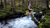 Size: 1192x670 | Tagged: safe, artist:mgrdash, derpibooru import, photographer:mgrdash, fluttershy, bat pony, pony, bat ponified, flutterbat, forest, irl, mountain, photo, ponies in real life, race swap, river, solo, stream, water