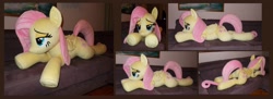 Size: 2304x836 | Tagged: safe, artist:calusariac, derpibooru import, fluttershy, pony, irl, lying down, photo, plushie, prone, solo